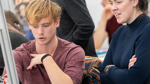 Student  in discussion with teacher