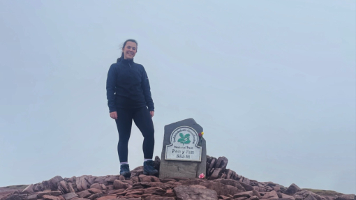 Natalie standing at the top of pen y fan