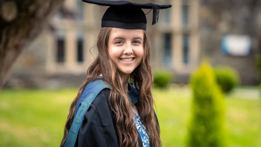 Picture from graduation of Cerys Bailey wearing cap and gown