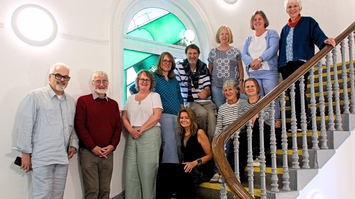 Group of people standing on staircase