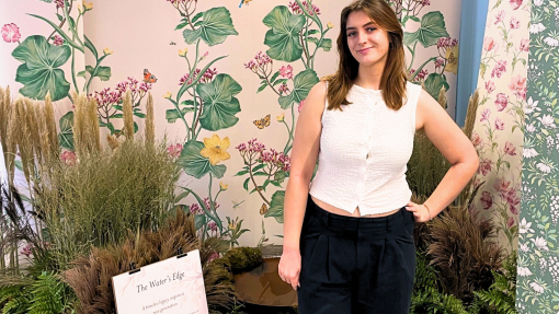 Anna Eynon with her textile display behind her