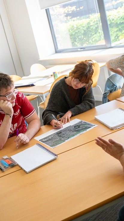 Image of students working on class project