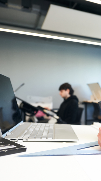 Architecture Student drawing with Laptop