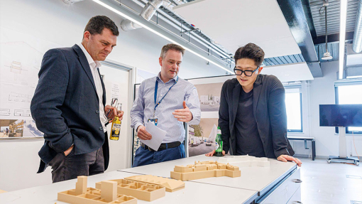 Architecture building display with student and staff