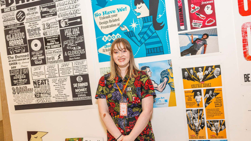 student in front of work display