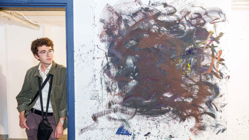 man looking at a painting