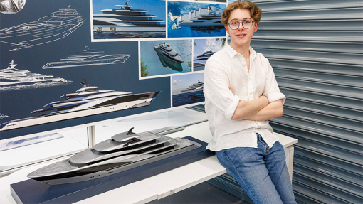 Automotive and Transport Design Summer Show Exhibition student next to work