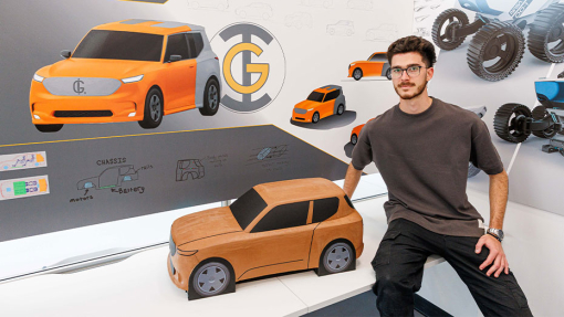 Automotive and Transport Design Summer Show Exhibition student next to work