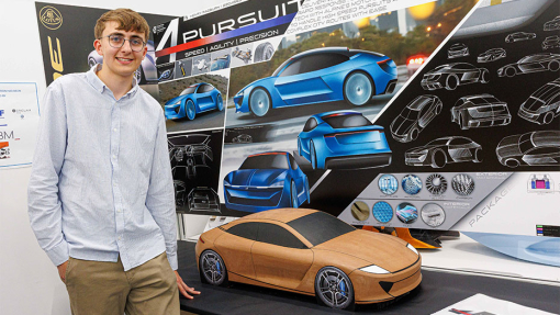 Automotive and Transport Design Summer Show Exhibition student next to work