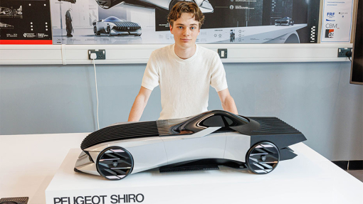 Automotive and Transport Design Summer Show Exhibition student next to work