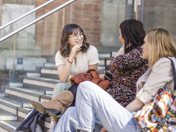 Students sat on steps outside Alex