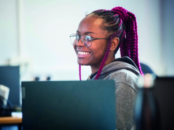 Girl smiling over laptop