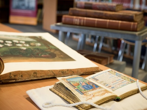 Old books laid out on a table