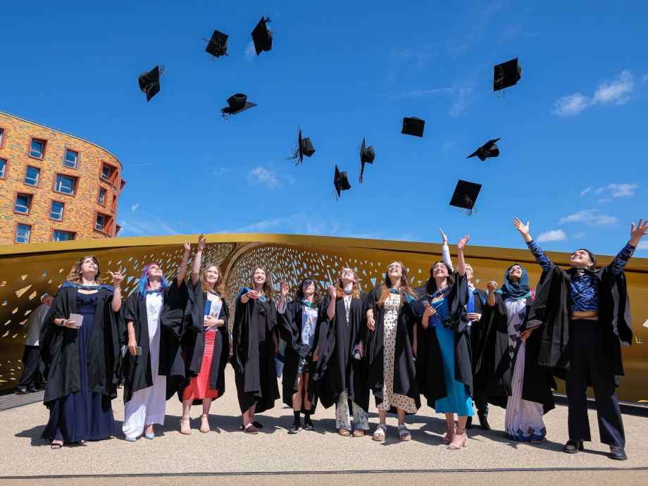 Students throwing mortar boards in Swansea