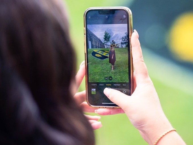 Student taking a photo on their phone