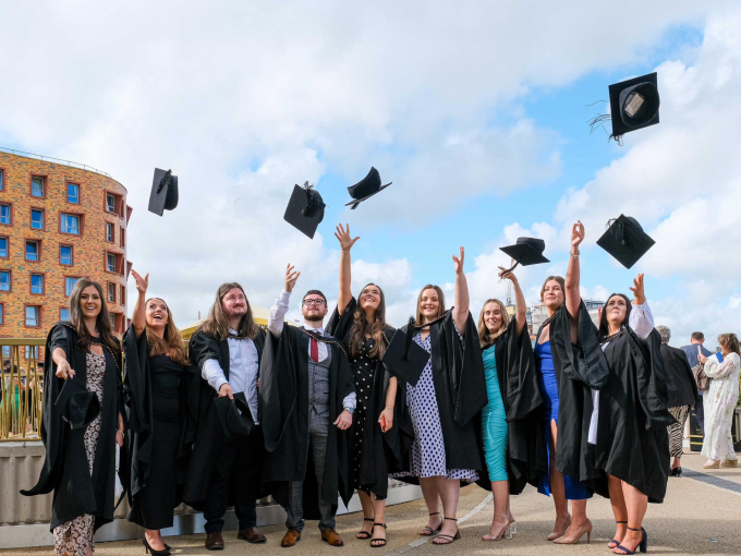 Students throwing their caps at their graduation