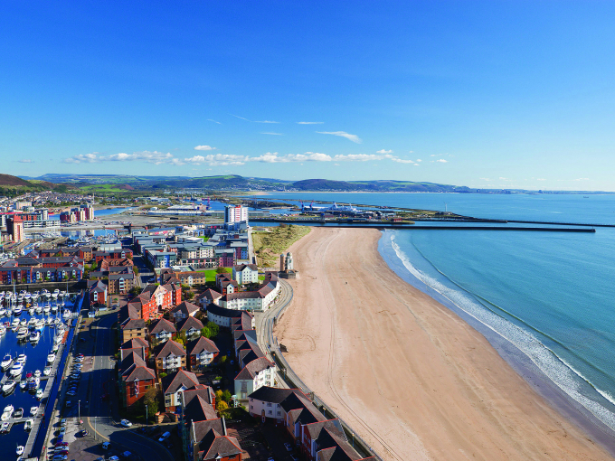 Aerial shot of Swansea including the beach and harbour