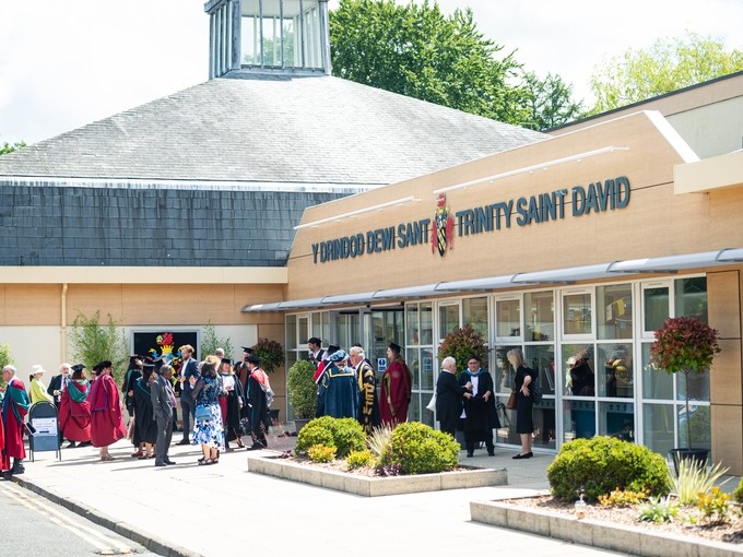 Graduation crowd outside a UWTSD building