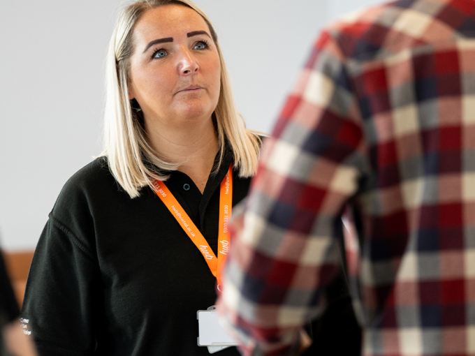 Staff member assisting a student