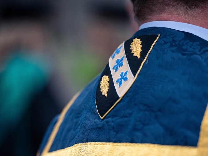 UWTSD badge on the back of a robe