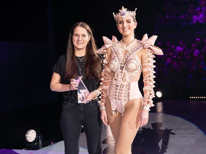 Agnes Olah next to a model in her winning Wearable Art competition design – Beneath.