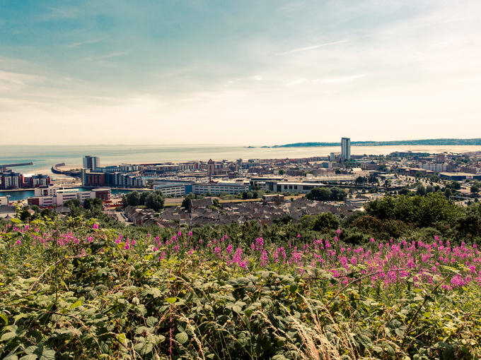 A view across Swansea from Kilvey Hill looking towards the Mumbles.