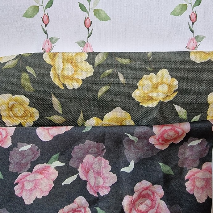 Samples of fabric patterned with images of roses. 