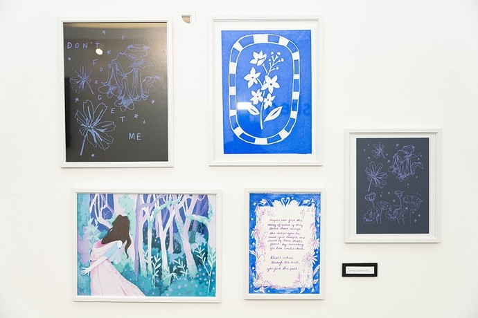 Five artworks on display united by a blue theme.