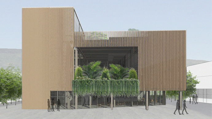 A large building with timber cladding, a balcony full of palm trees on its first floor, and glass frontage on the ground floor which is shaded by an overhanging cantilever. 