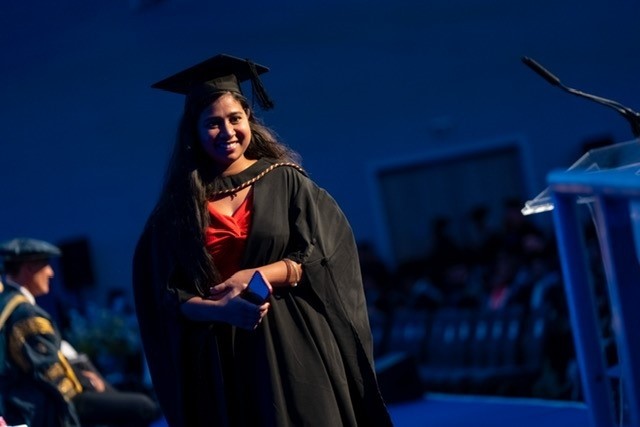 UWTSD Graudate walking across the stage