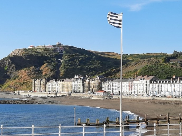 Brittany flag flying on a flag pole on Aberystwyth pier