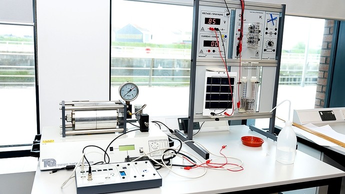 A range of scientific equipment on a workbench.