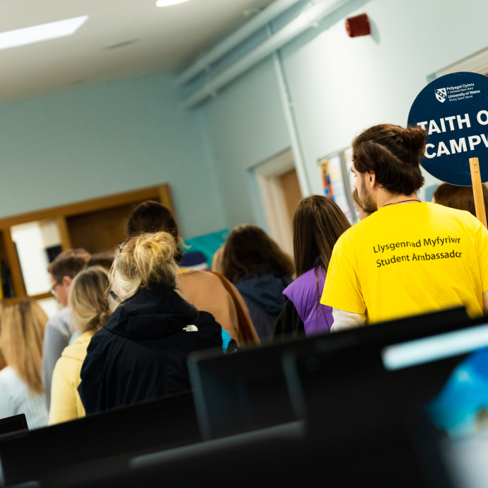 Student Ambassador giving tour of study spaces in Carmarthen