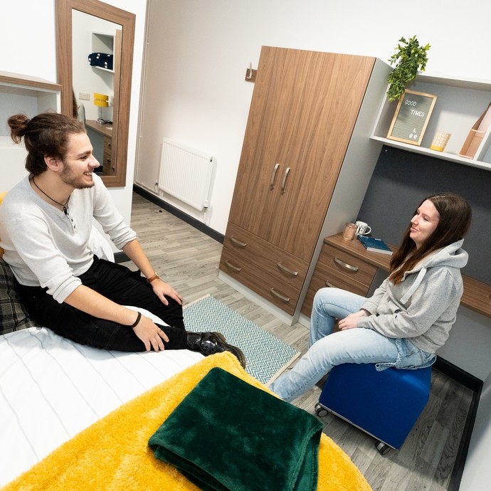 Two students chatting in student accommodation 