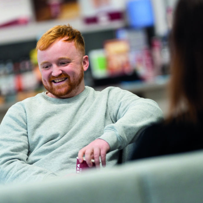 Student sitting relaxed smiling