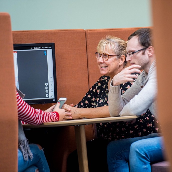 Staff and students working in a Pod