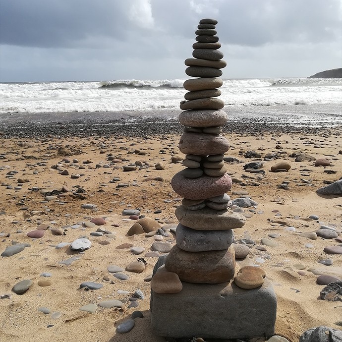 Stacked pebbles on a beach