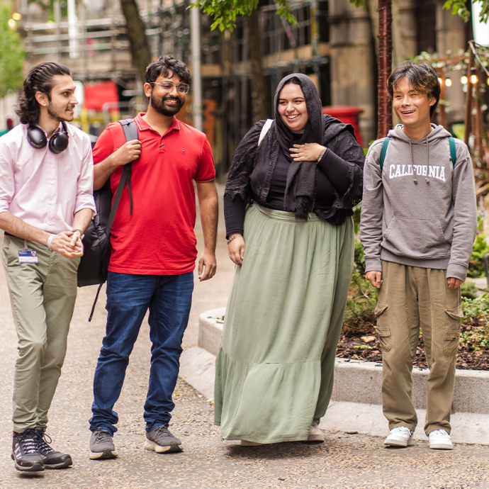 Row of students walking and chatting